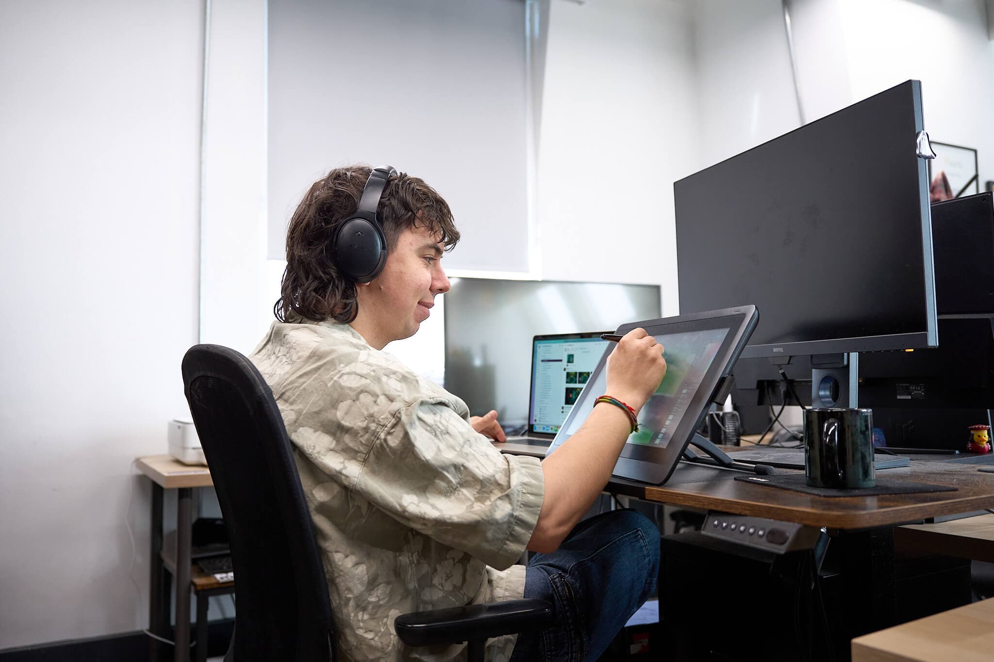 Startup founder working on a digital design at the Akcela incubator in Norwich