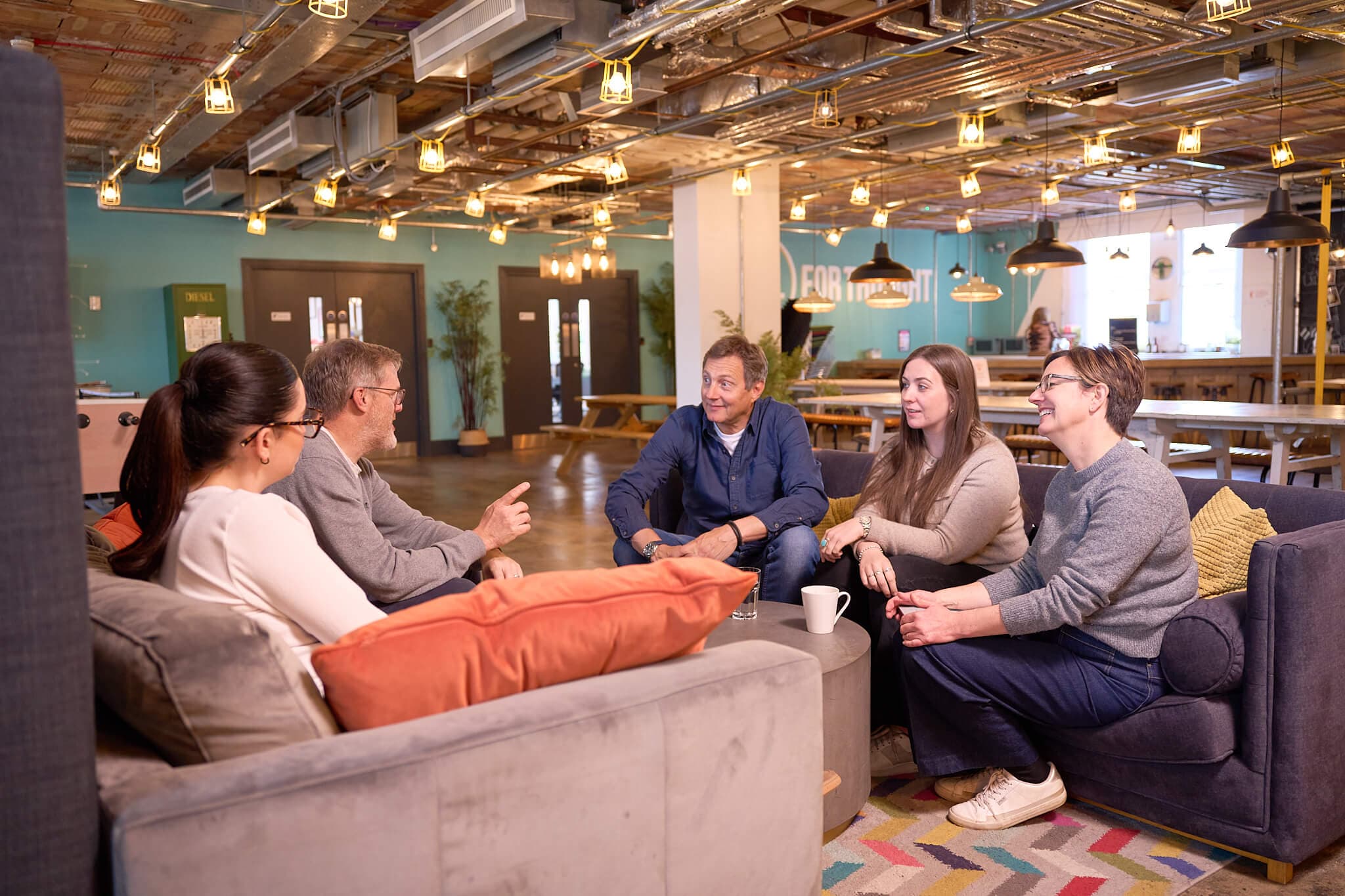 The Akcela startup community talking together at Fuel Studios in Norwich